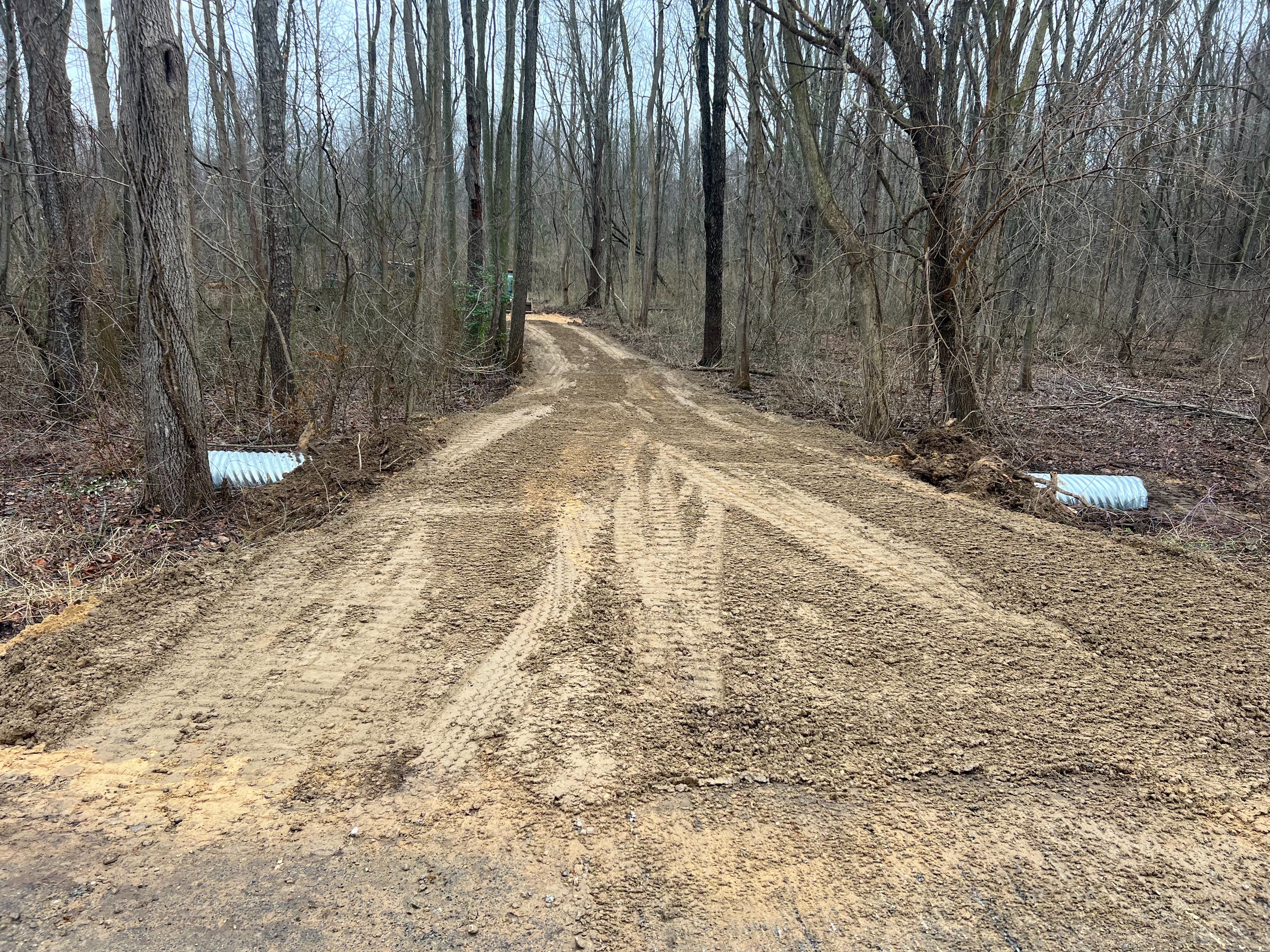 Drainage culvert installation under driveway in Allegan Michigan