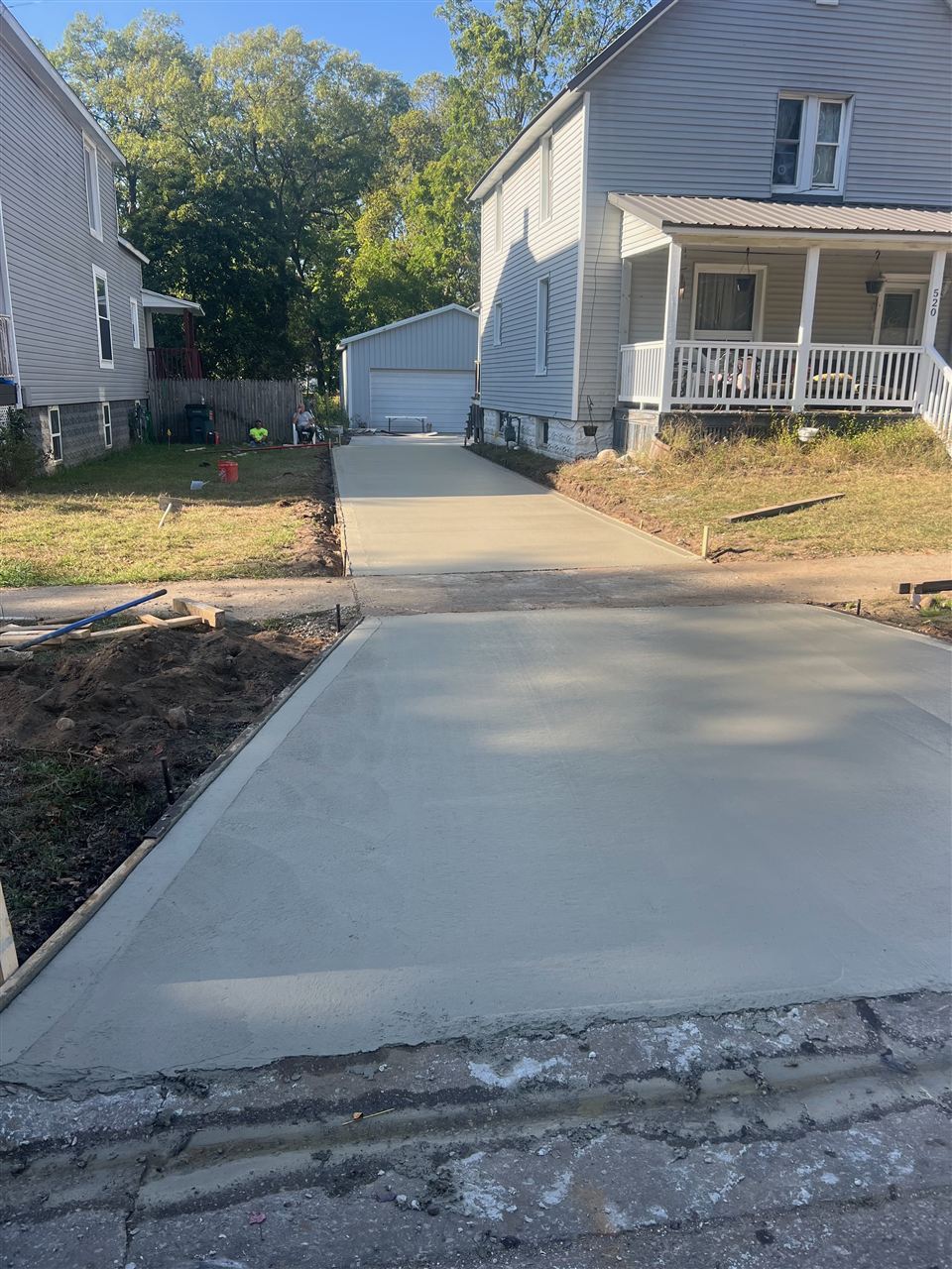 Finished concrete driveway at a residential property in Plainwell, Michigan